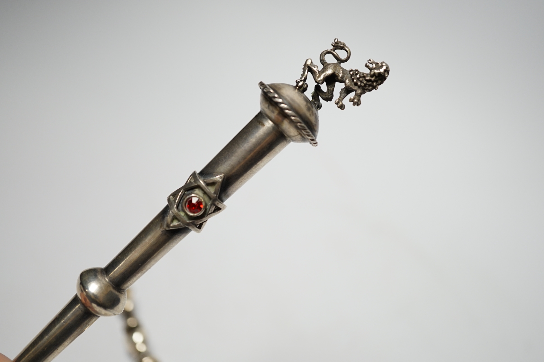 A late 19th century Russian 84 zolotnik torah pointer, with lion finial, 21.5cm and a plated example.